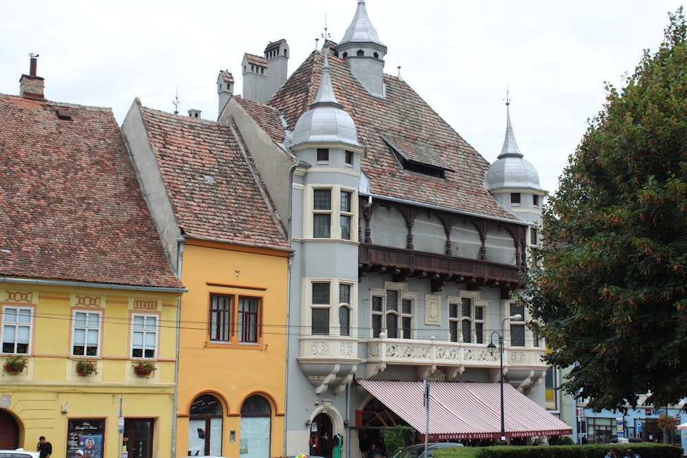 a row of buildings with a clock tower on top