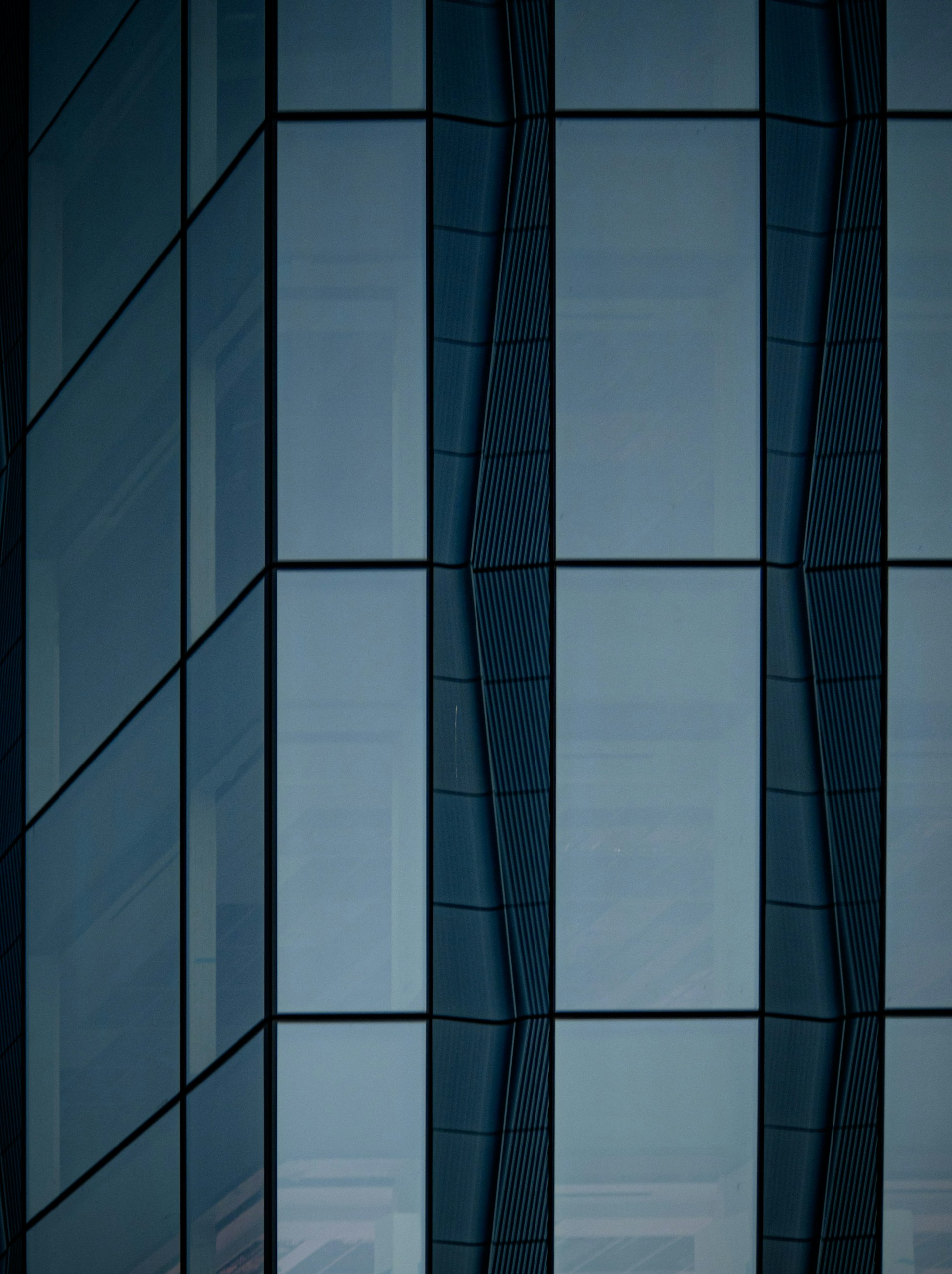 an airplane is flying in front of a building