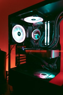 a computer case with a fan and speakers on top of it