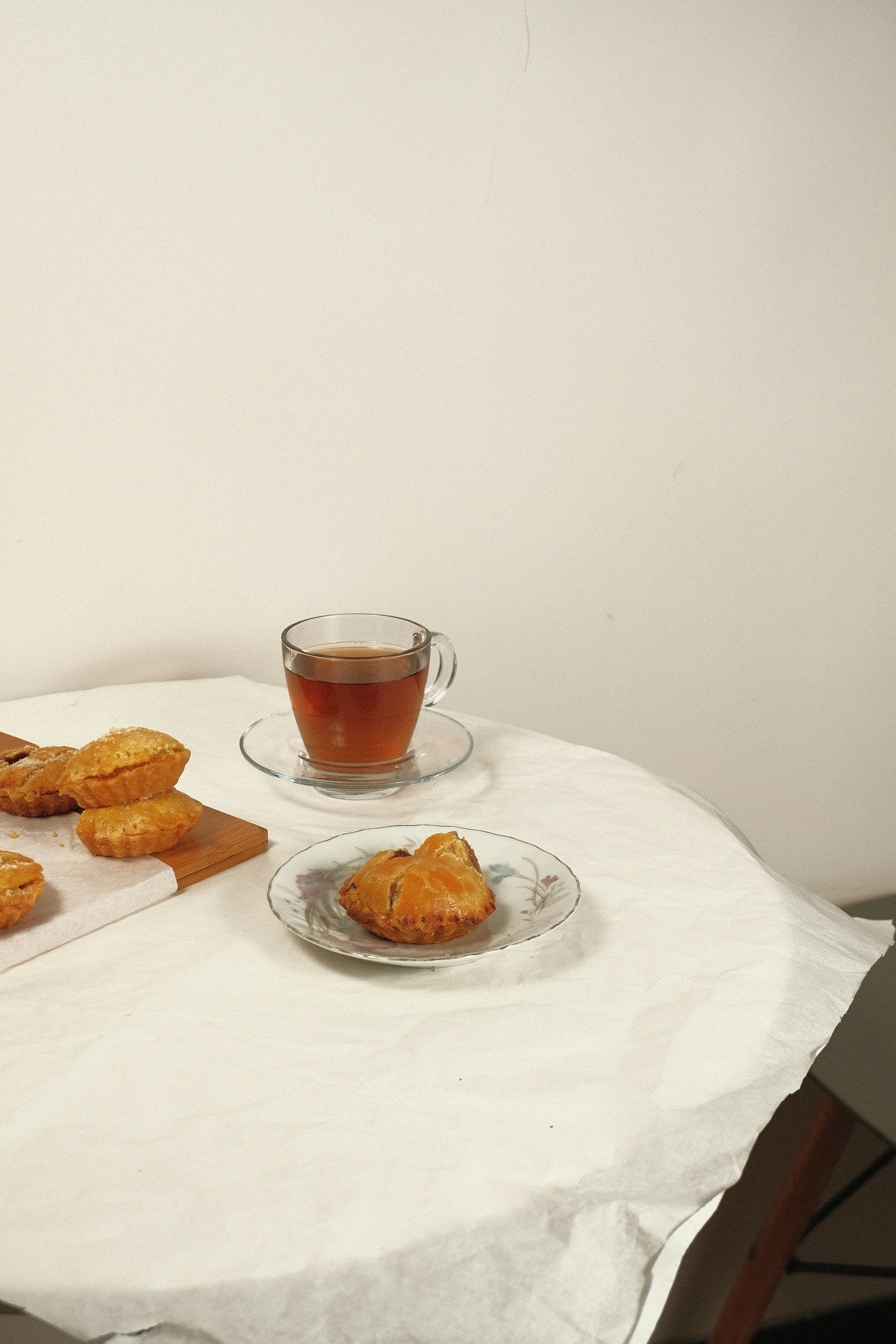 a cup of tea and some pastries on a table
