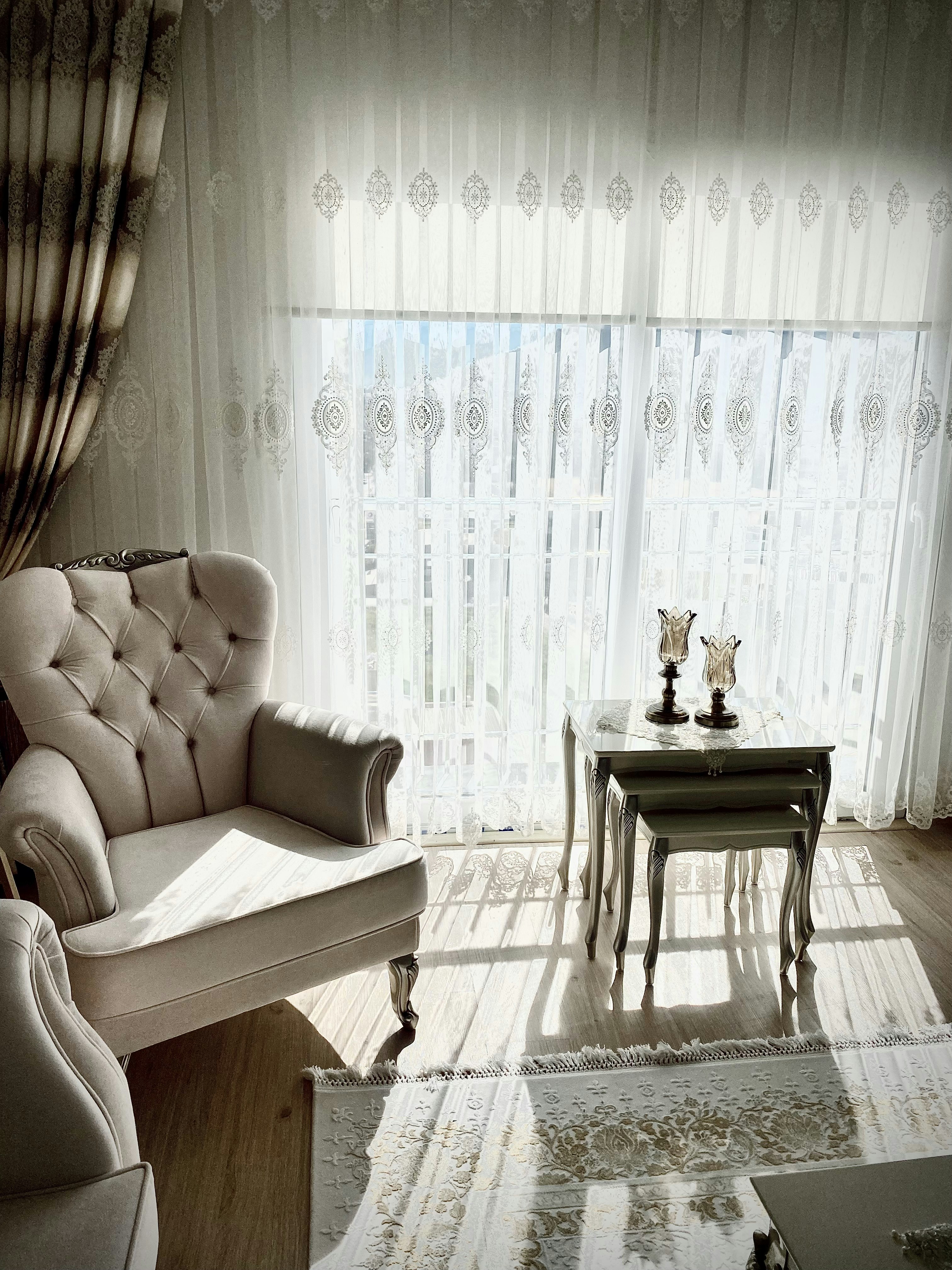 a living room filled with furniture and a window