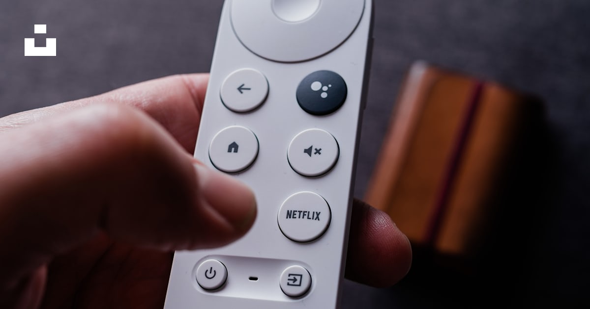 A person holding a remote control in their hand photo – Free Wiesbaden ...