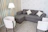 Cozy living room corner with a linen sofa cover and soft cushions in warm tones.