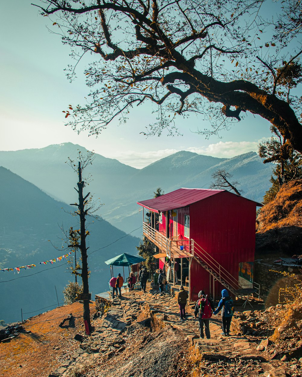 a group of people standing on top of a mountain