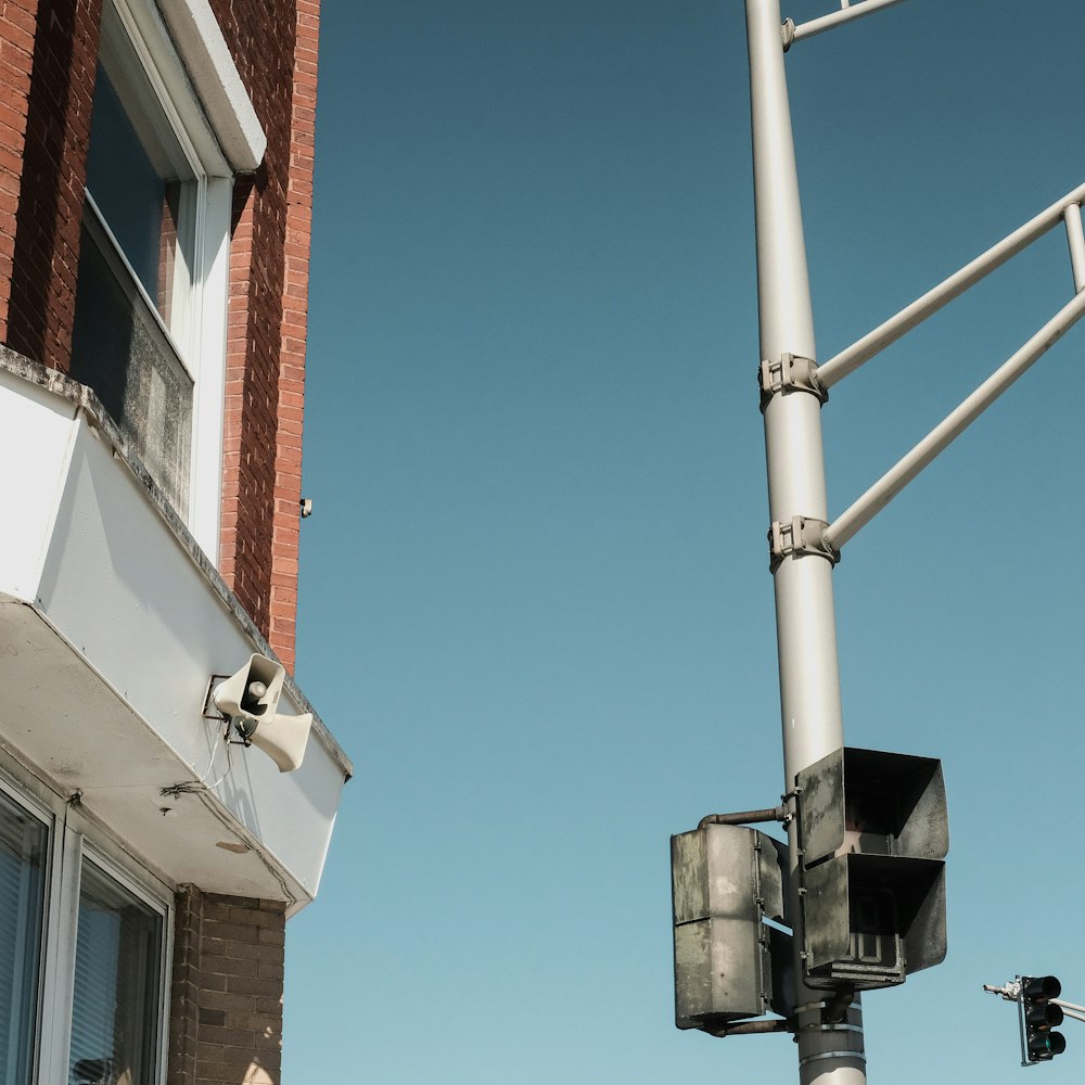 a traffic light sitting next to a tall building