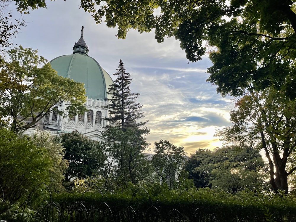 a dome on top of a building surrounded by trees