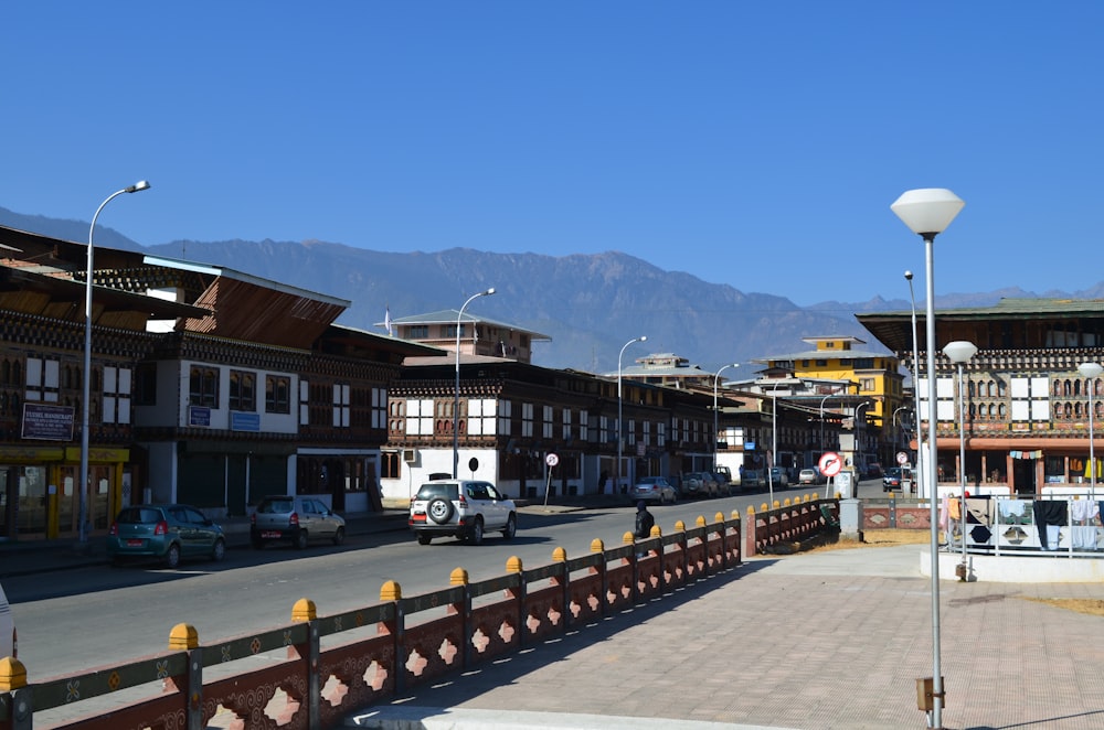 a city street with mountains in the background