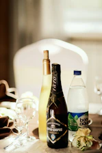 Bottled water neatly arranged on a table at a festive event.