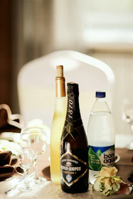 Bottled water neatly arranged on a table at a festive event.