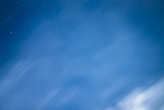 A calm night scene with soft purple and blue hues, symbolizing tranquility and healing.