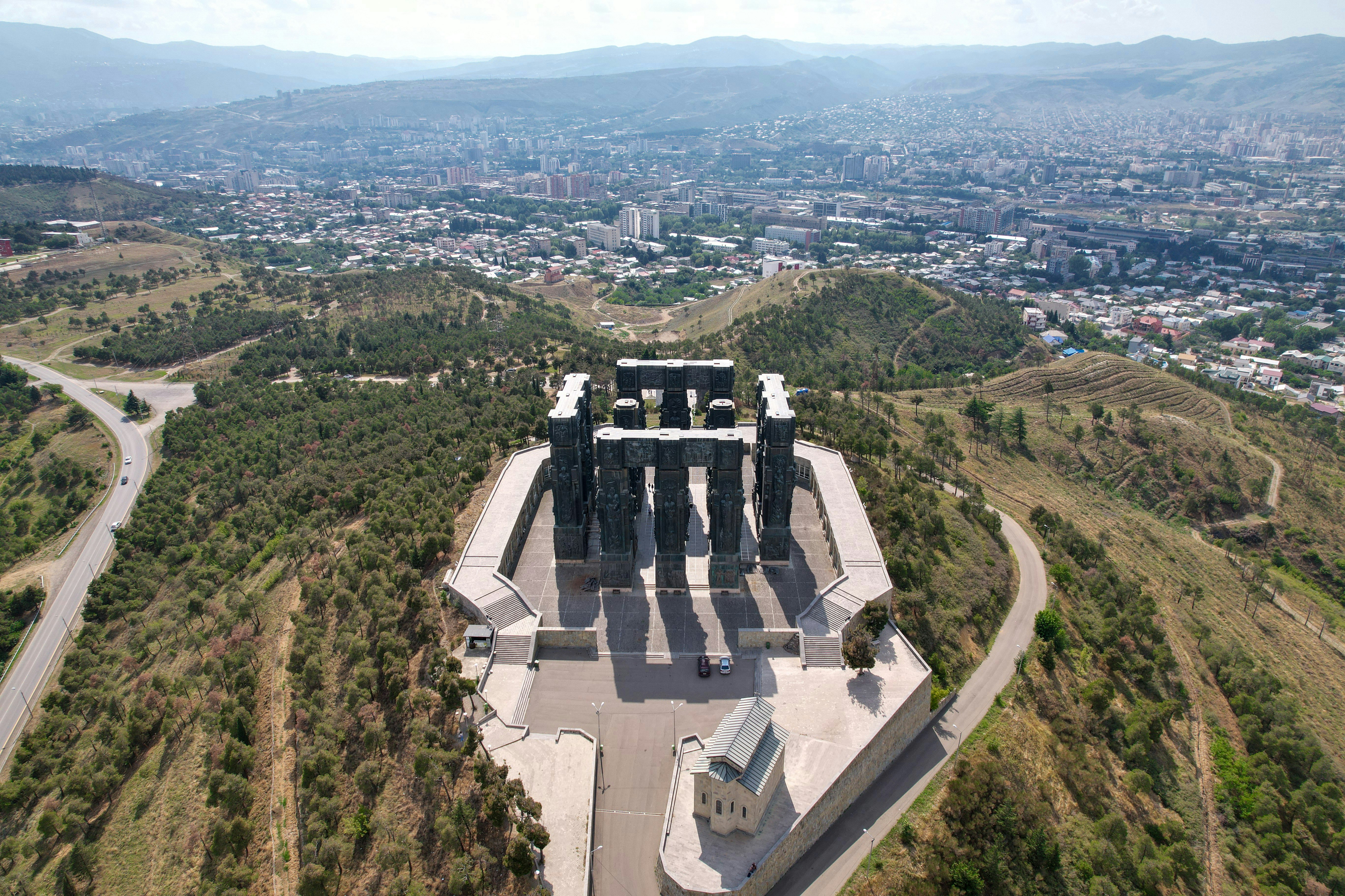 an aerial view of a monument in the middle of a valley, 