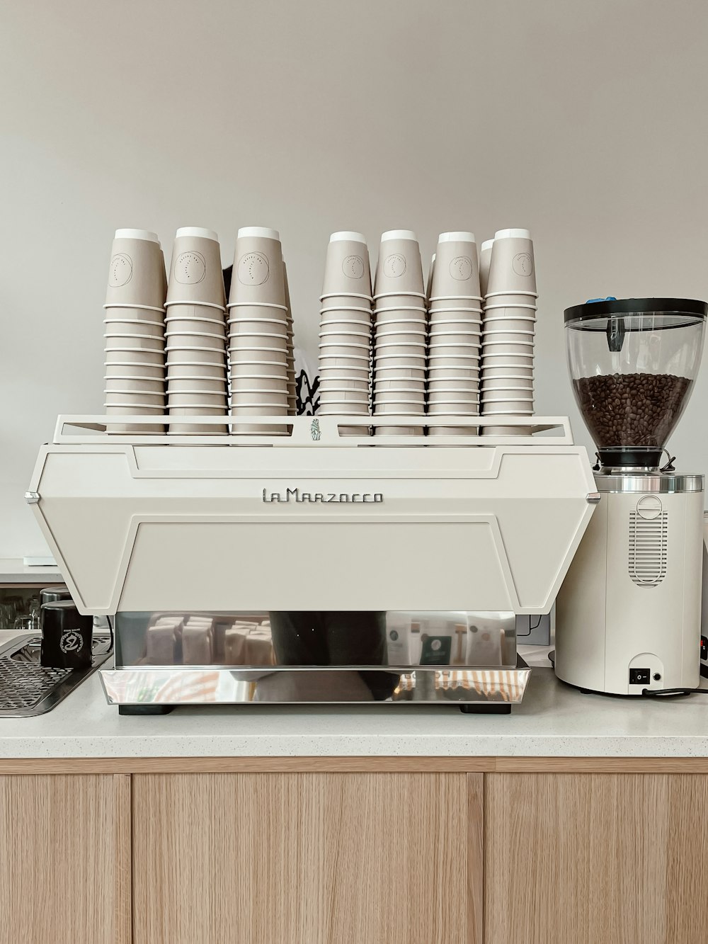 a white coffee maker sitting on top of a counter