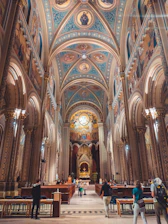 A group of visitors exploring the stunning architecture of Santuario de Las Lajas.