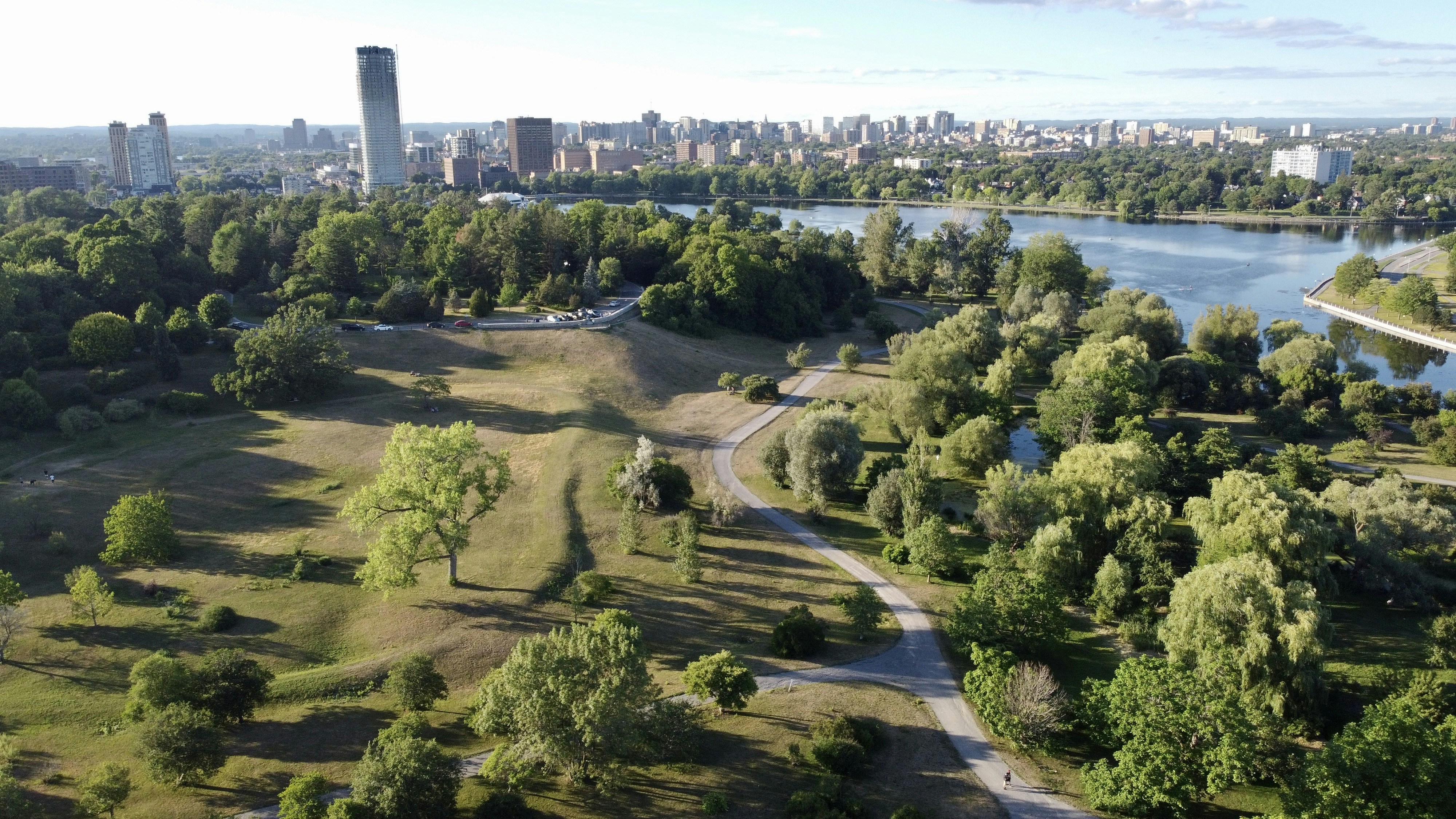 an aerial view of a park with a river running through it