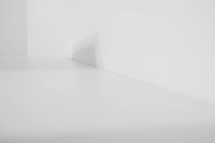 a black and white photo of a white room
