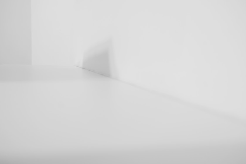 a black and white photo of a white room