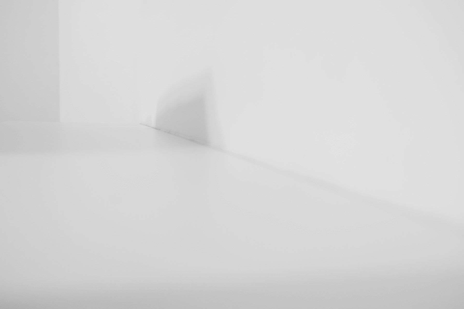 a black and white photo of a white room