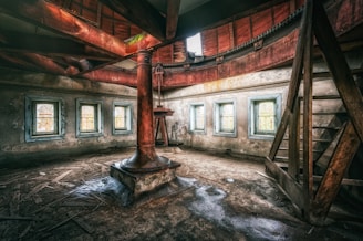 an old room with a clock and windows