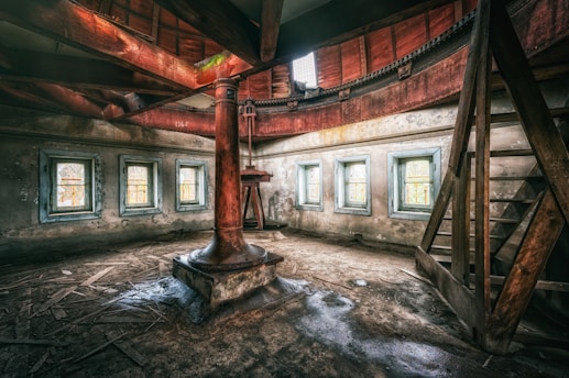 an old room with a clock and windows