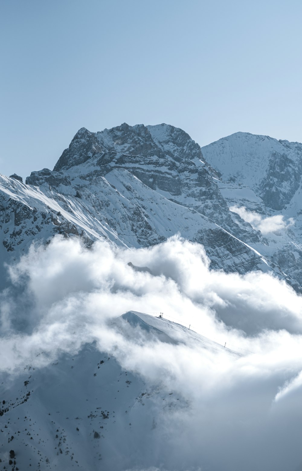 a view of a snowy mountain range from a distance