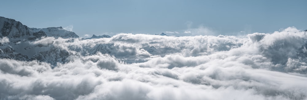 a view of a mountain range covered in clouds