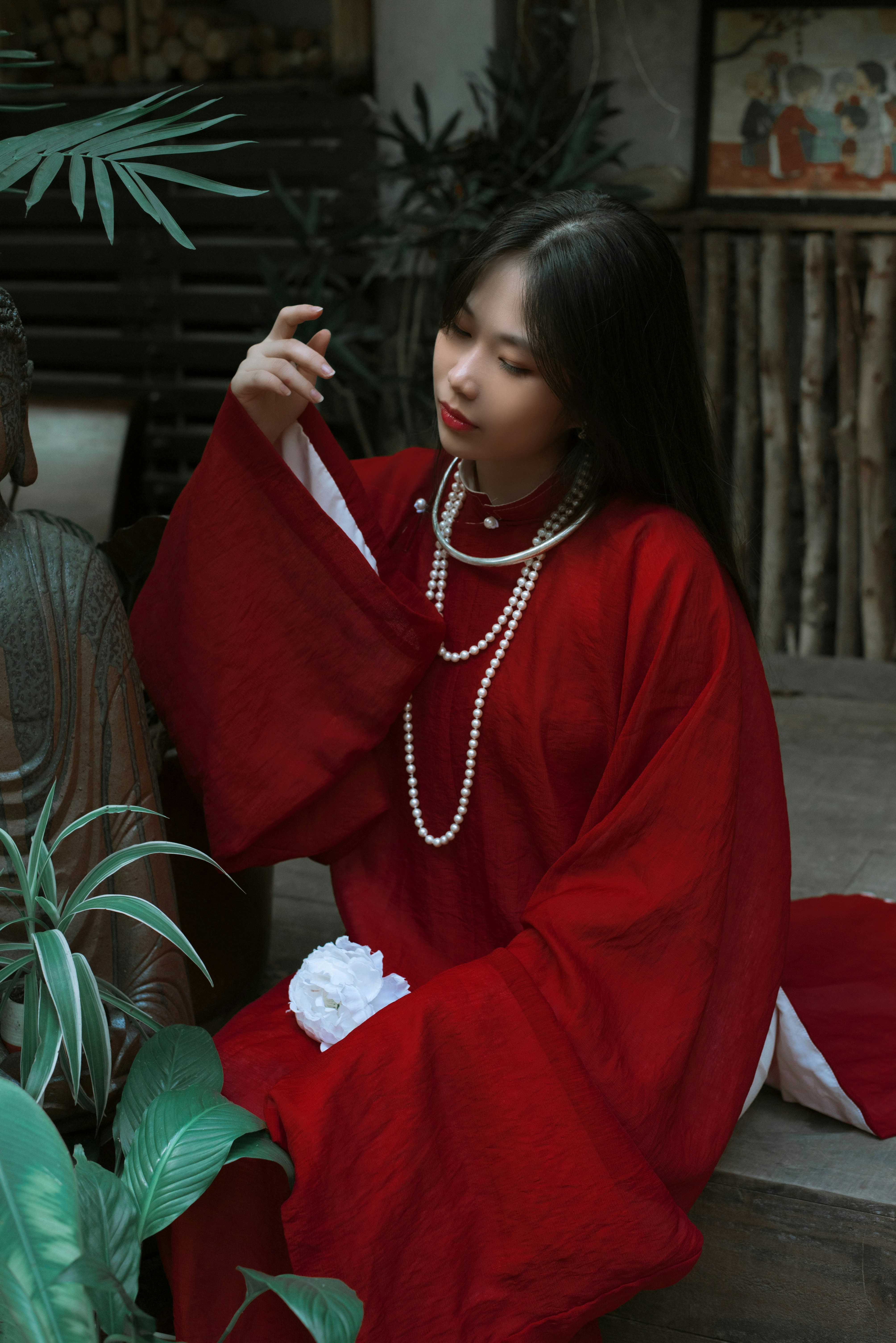 A woman in a red dress sitting on a bench photo – Free Apparel Image on ...