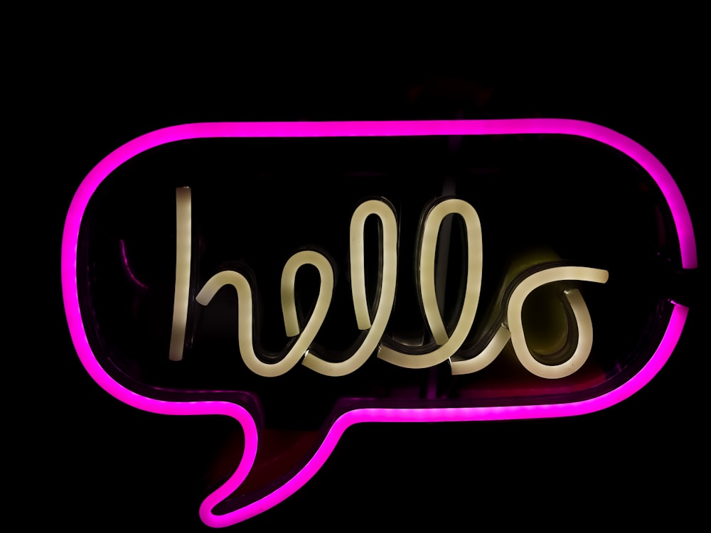 a neon sign with the word hello written in it