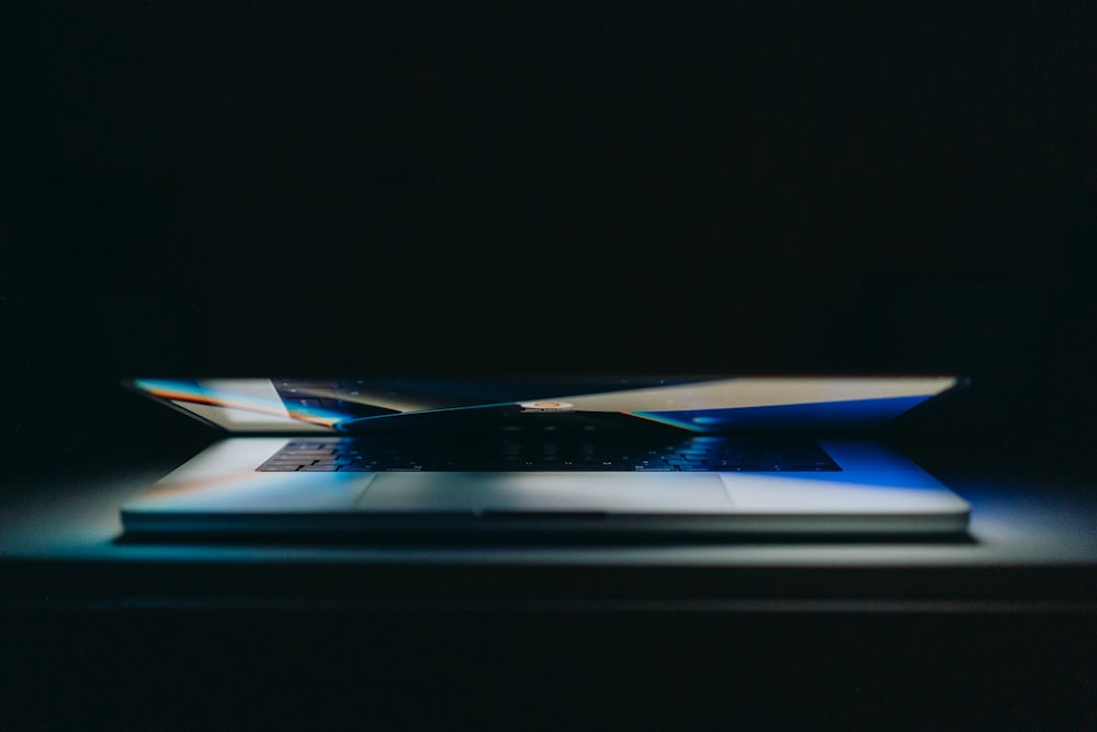 a laptop computer sitting on top of a table