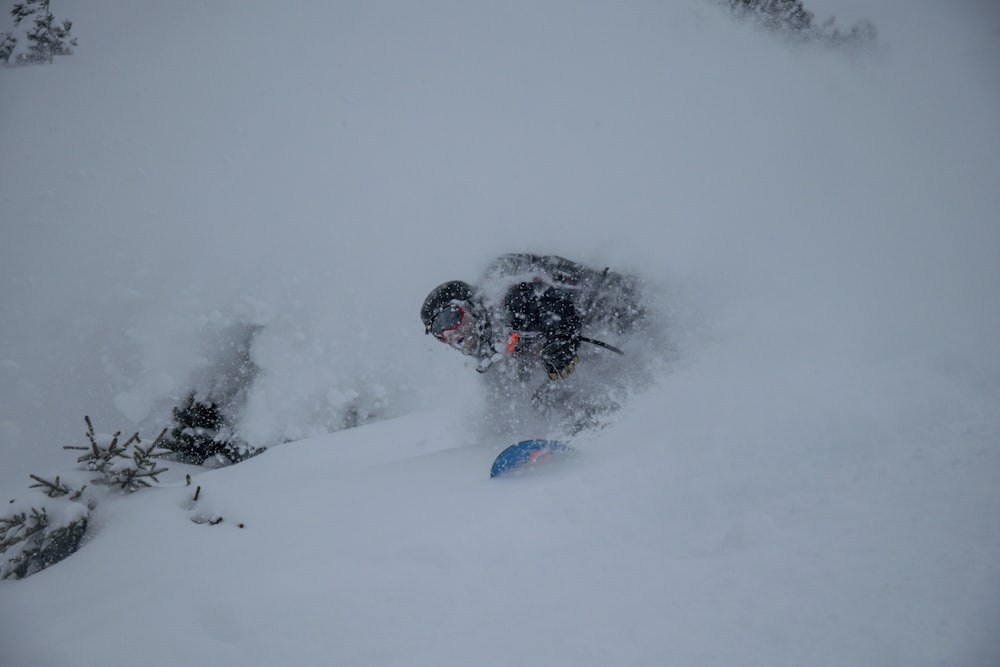 a person on a snowboard in the snow