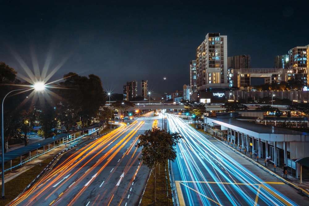 a city street filled with lots of traffic at night