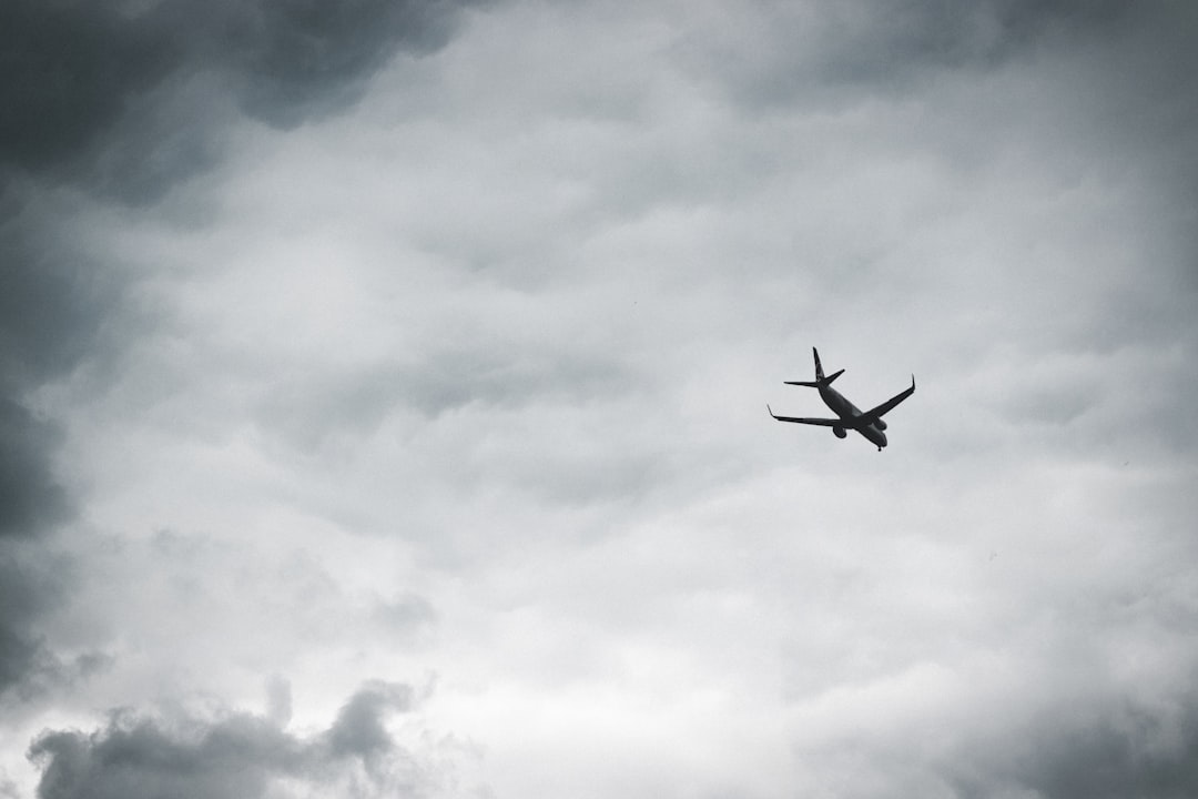 an airplane is flying through a cloudy sky, Flight 23556