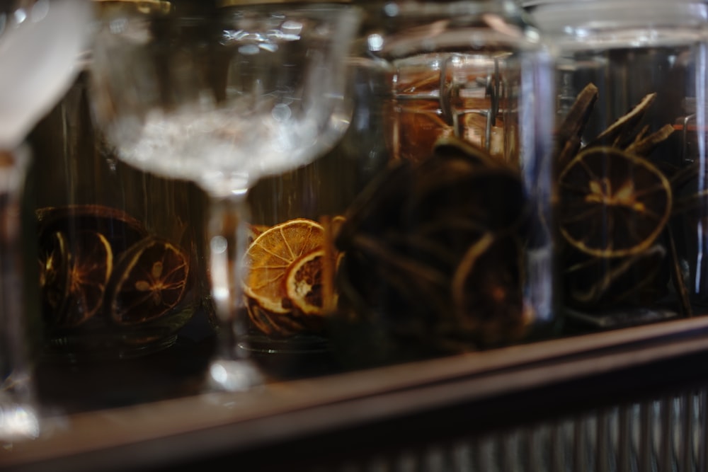 a close up of a wine glass and some orange slices