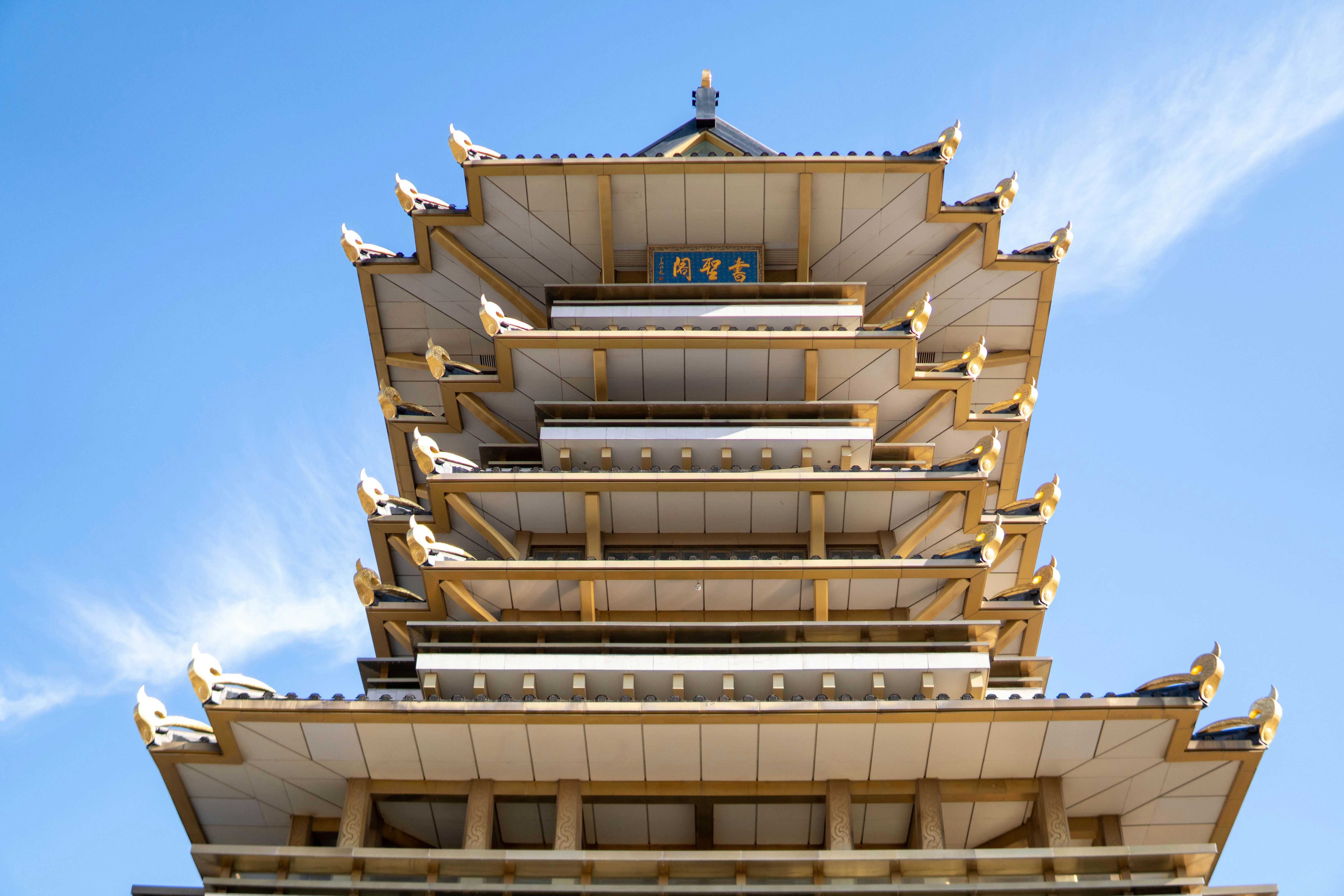 a tall building with a blue sky in the background