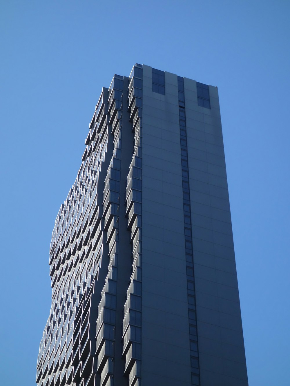 a very tall building with a sky in the background