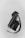 A sleek, cylindrical leather handbag is paired with matching black leather gloves. The bag features a silver clasp and a strap, adding a touch of elegance.