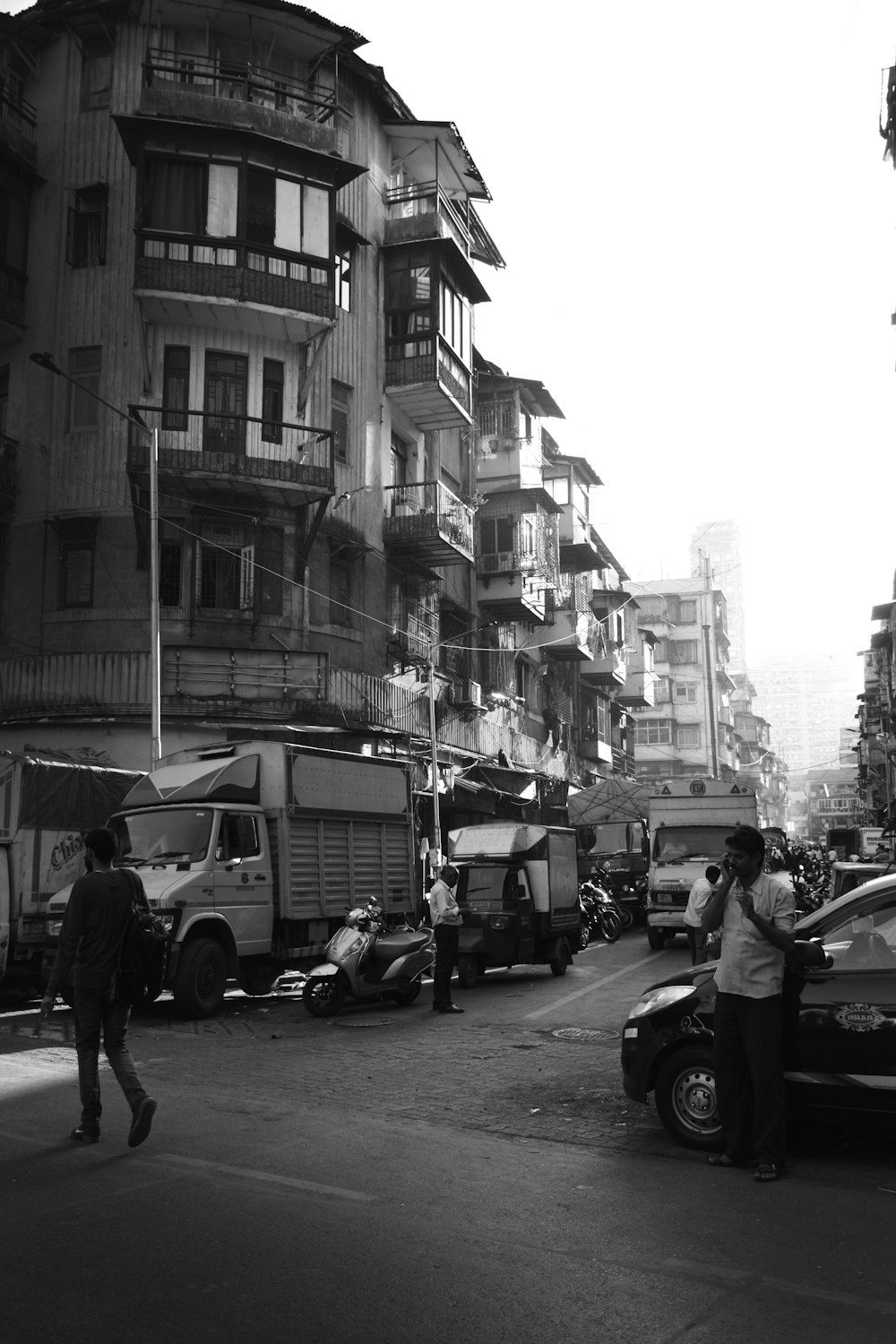 a black and white photo of a busy city street