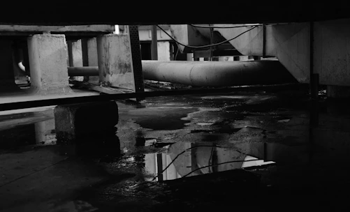 A dark, moody film set with industrial elements.
