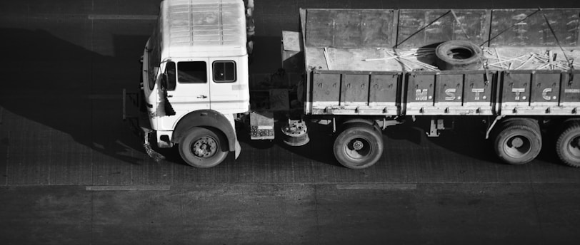 a black and white photo of a truck