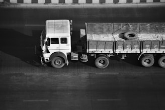 a black and white photo of a truck