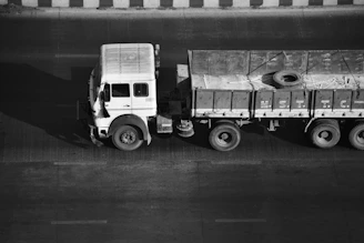 a black and white photo of a truck
