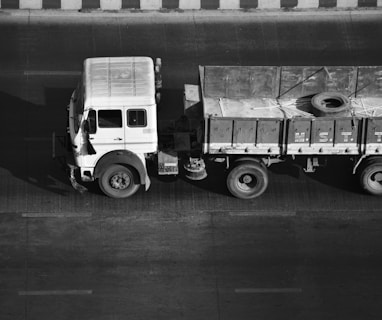 a black and white photo of a truck