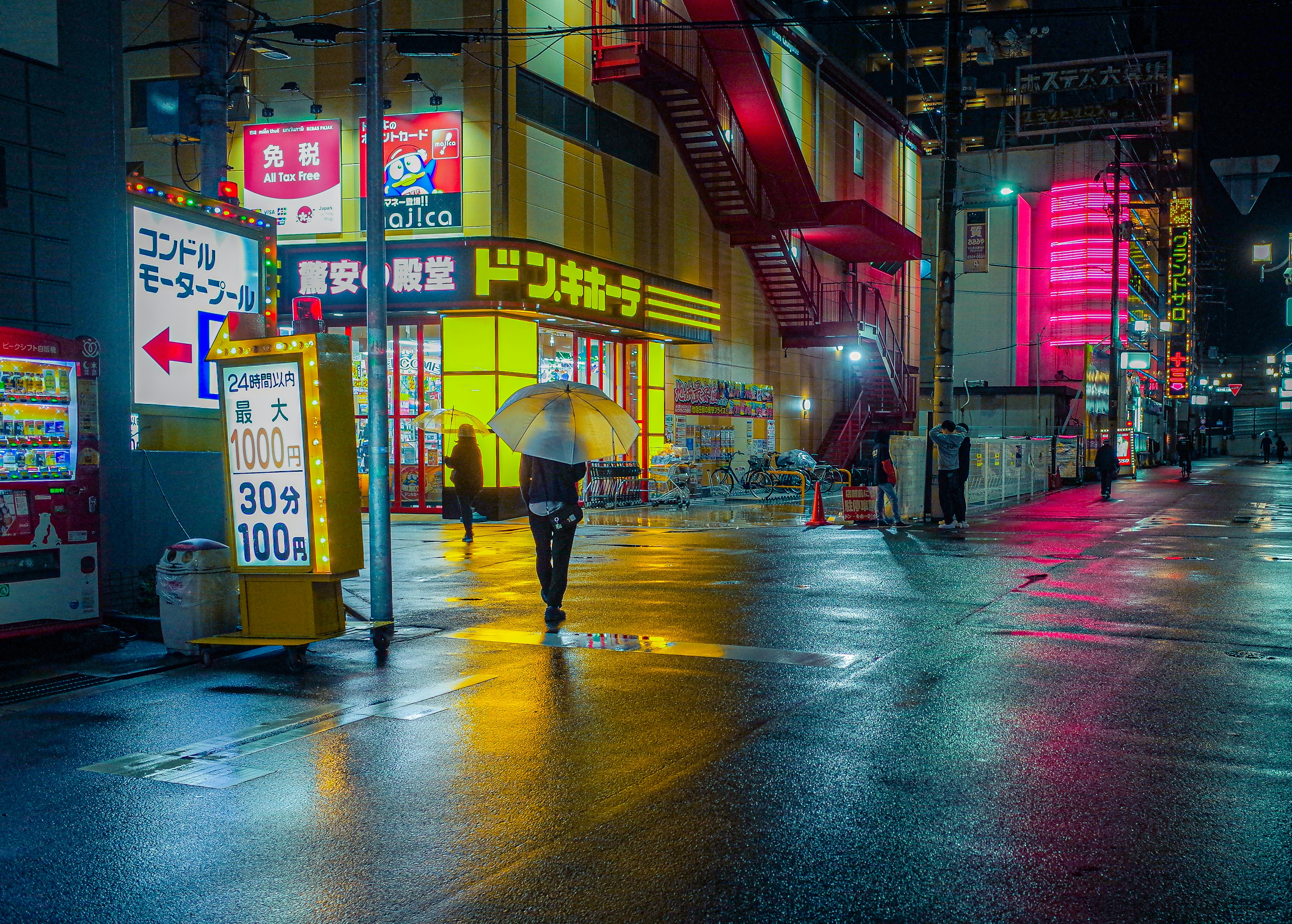 Woman with umbrella in neon city