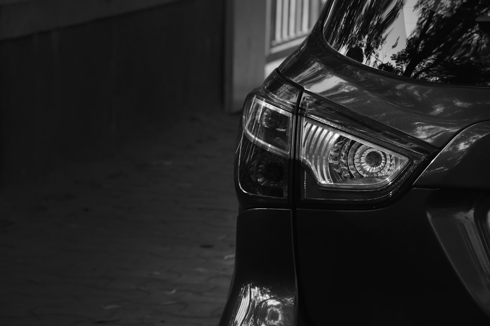 a close up of a car parked on a street