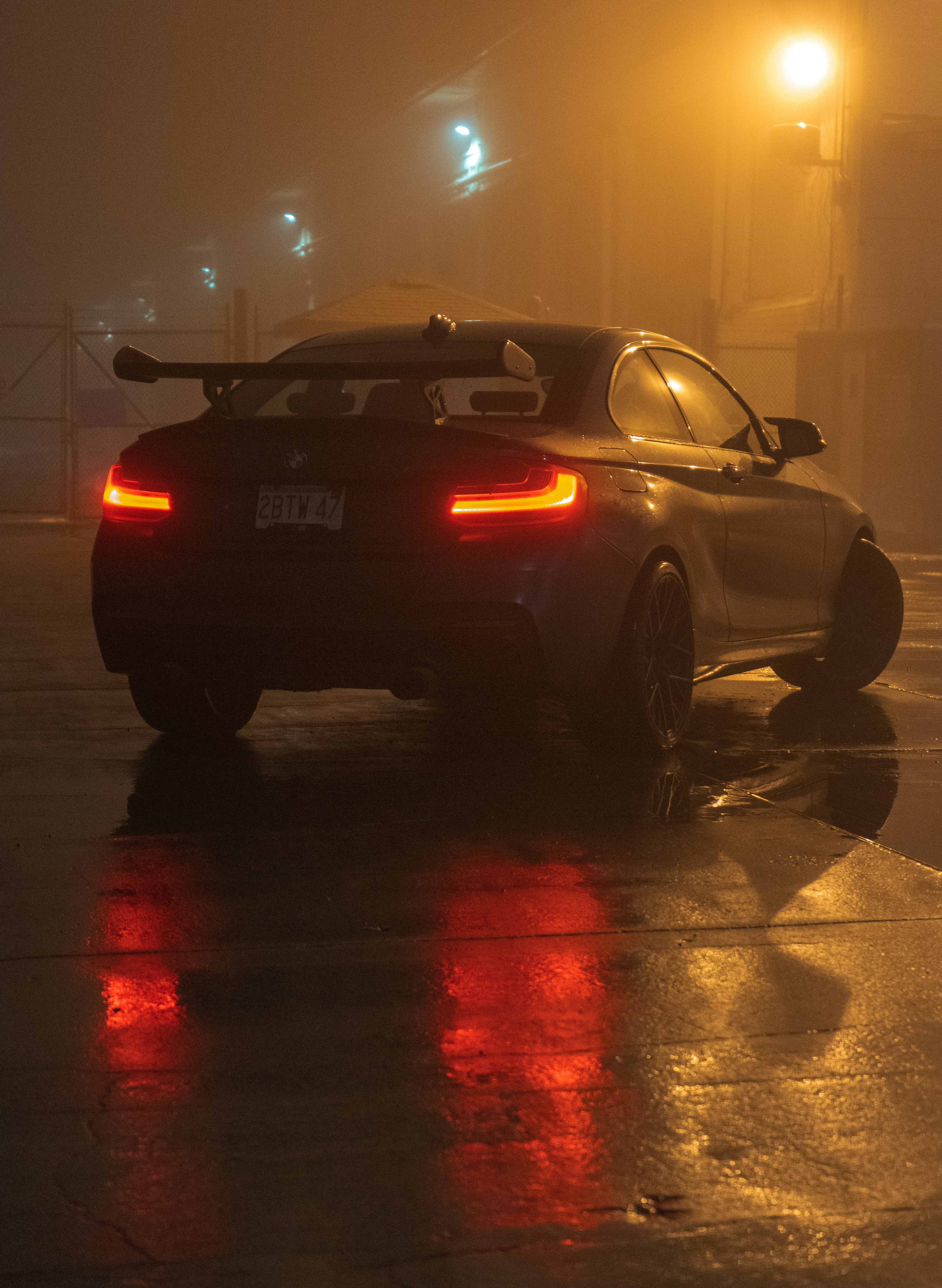 a car parked on the side of the road in the fog