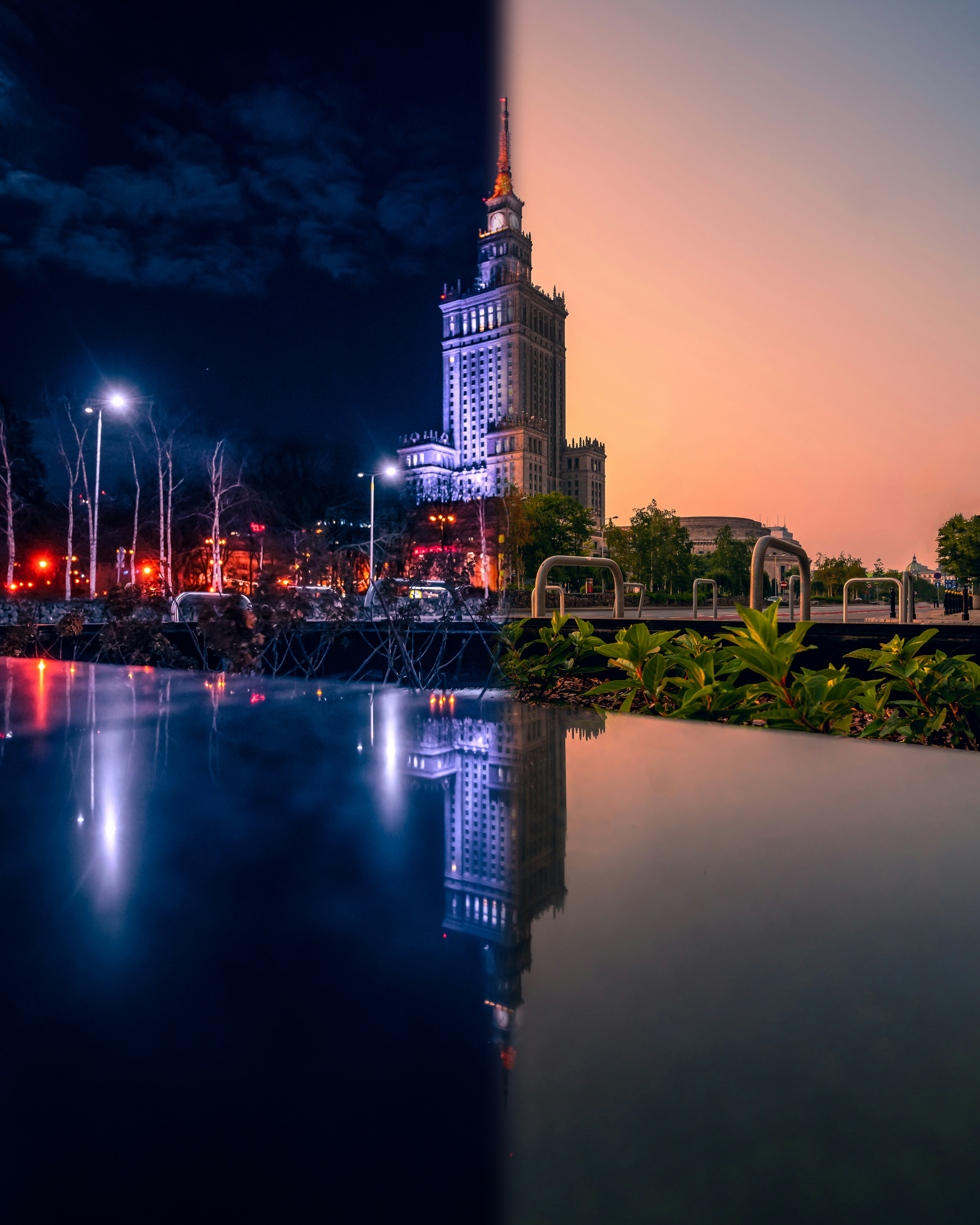a bridge over a body of water with a city in the background
