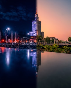 a bridge over a body of water with a city in the background