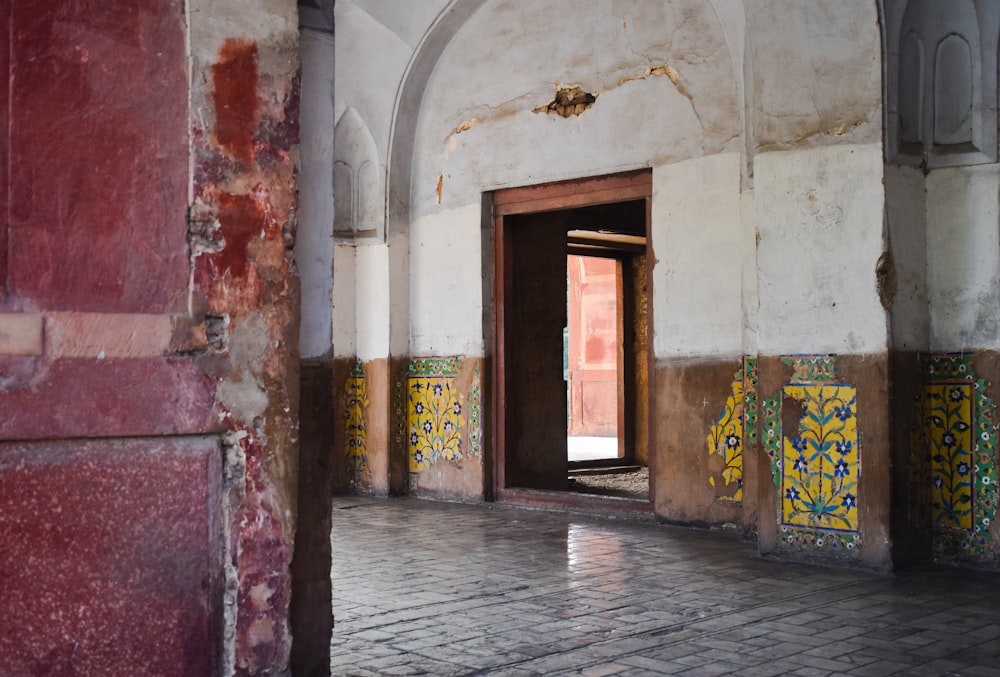 a room with a brick floor and a doorway