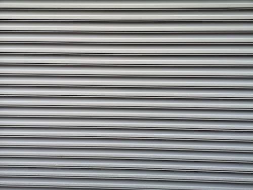 Motorised security roller shutter