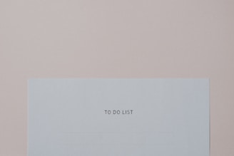 a piece of paper with the words to do list on it