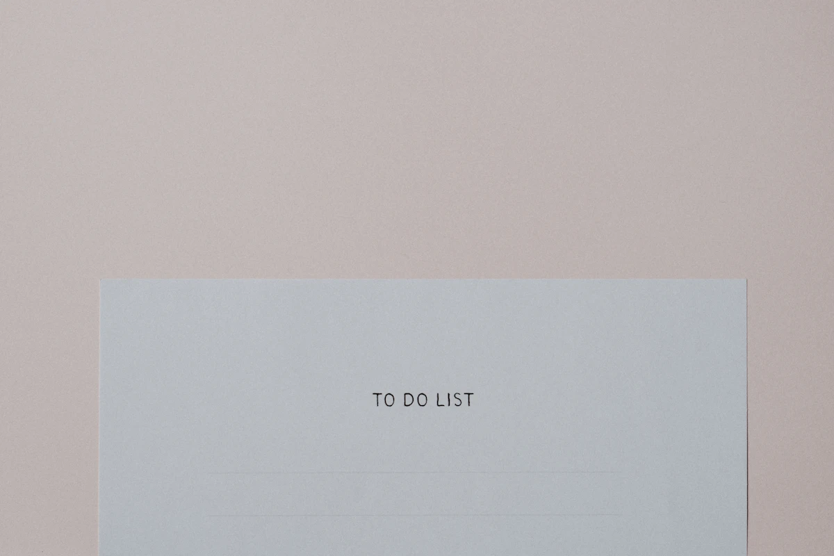 Handwritten to-do list on paper used to sort small business tasks with the Eisenhower matrix